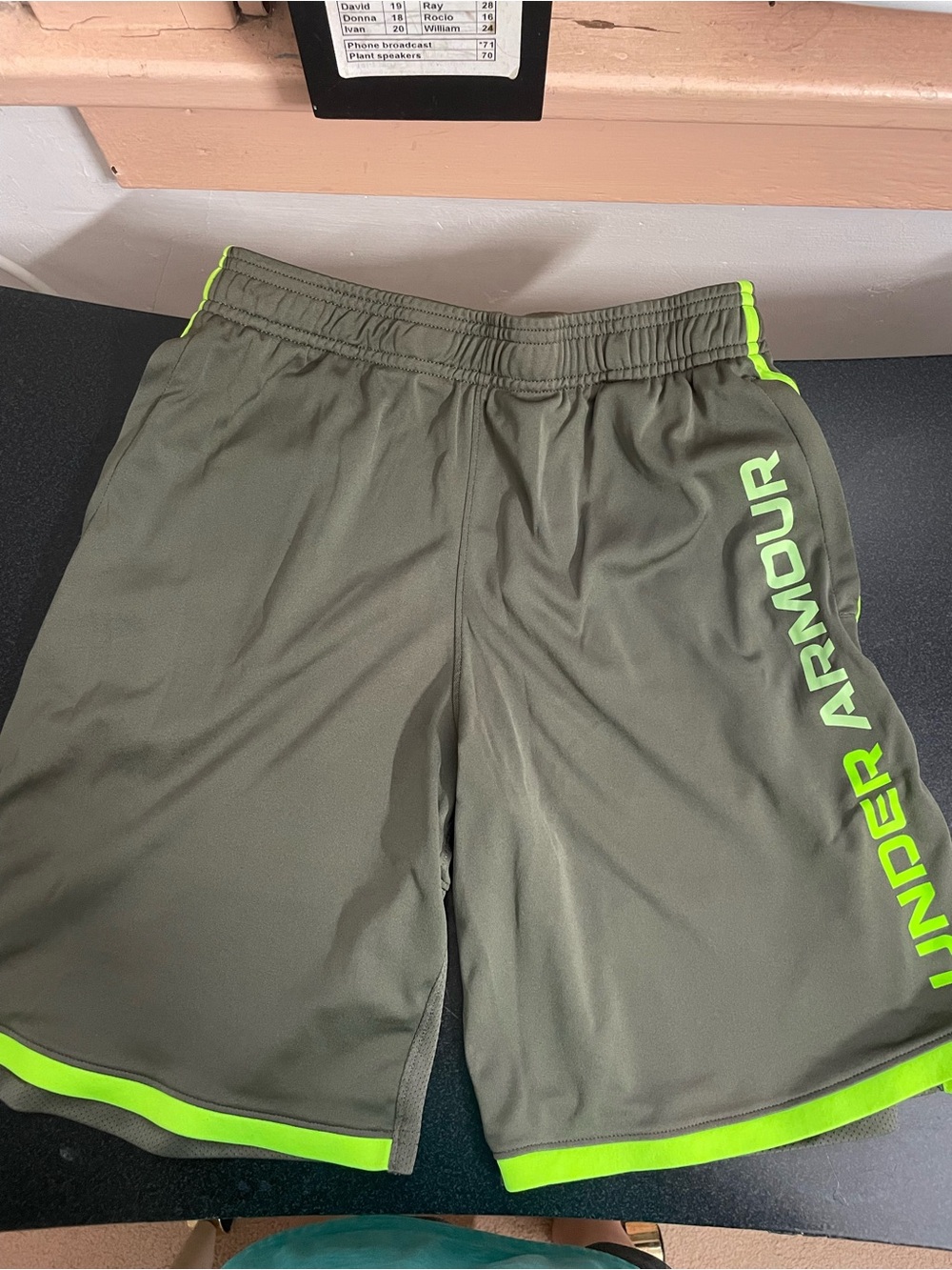 Under Armour teens Olive Green Athletic Shorts with Neon Green Trim( size: L)